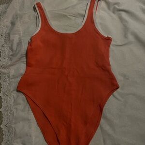Bodysuit orange never been worn